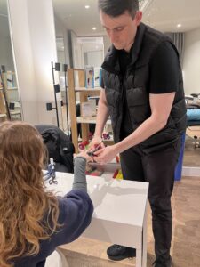 New Action Rehab Clinics Open in Swan Hill and Gisborne - Get Support for Finger, Hand, Wrist, Elbow & Shoulder Injuries | Action Rehab - Shoulder, Elbow, Wrist and Hand Physiotherapists Therapist fitting a thermoplastic splint to a patient’s finger during a hand therapy session with Action Rehab
